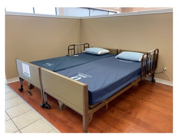 Can you push two hospital beds together to make one bed?